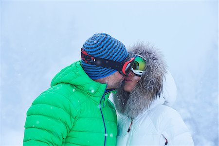 simsearch:649-08924209,k - Mature couple kissing in falling snow, Gstaad, Switzerland Stock Photo - Premium Royalty-Free, Code: 649-08924211