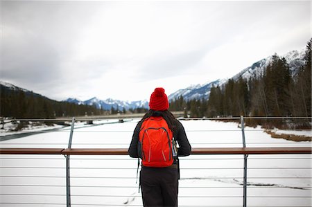 simsearch:614-06625125,k - Hiker on bridge looking at snow capped mountains, Banff, Canada Stock Photo - Premium Royalty-Free, Code: 649-08924627
