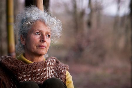 simsearch:649-08924209,k - Portrait of grey haired mature woman gazing in woodland at dusk Stock Photo - Premium Royalty-Free, Code: 649-08923209