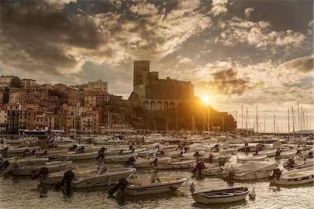 View of harbour yachts and castle at sunset, Lerici, Liguria, Italy Stock Photo - Premium Royalty-Free, Code: 649-08923831