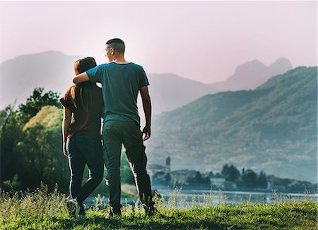 simsearch:649-08239088,k - Couple standing in rural setting, looking at view, rear view Stock Photo - Premium Royalty-Free, Code: 649-08949642