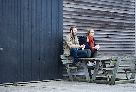 simsearch:649-07238896,k - Male and female designers sitting on bench outside design studio Stock Photo - Premium Royalty-Free, Code: 649-08949792
