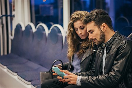 simsearch:862-06541761,k - Couple using mobile phone in train, Florence, Italy Stock Photo - Premium Royalty-Free, Code: 649-08950153