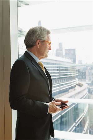 Businessman in coffee area in office, London, UK Stock Photo - Premium Royalty-Free, Code: 649-08950195