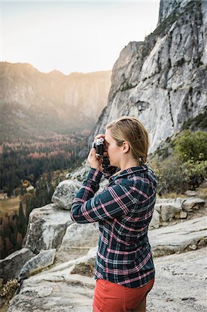 plaid shirt - Woman photographing landscape from rock formation, Yosemite National Park, California, USA Stock Photo - Premium Royalty-Free, Code: 649-08950379