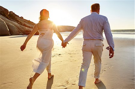 simsearch:614-07239972,k - Mature couple walking along beach, hand in hand, rear view, Cape Town, South Africa Stock Photo - Premium Royalty-Free, Code: 649-08950594