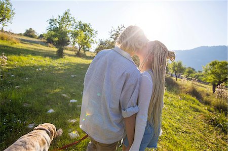 simsearch:400-05724021,k - Romantic young couple walking dog in sunlit rural field, Majorca, Spain Stock Photo - Premium Royalty-Free, Code: 649-08951030