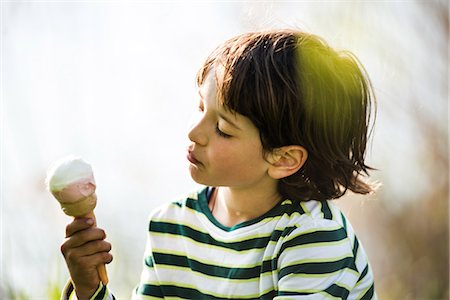 simsearch:649-09078617,k - Boy gazing at ice cream cone in park Stock Photo - Premium Royalty-Free, Code: 649-08951070