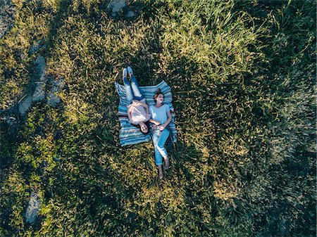 simsearch:649-07280729,k - Overhead view of friends lying on blanket on grass, Firenze, Toscana, Italy, Europe Stock Photo - Premium Royalty-Free, Code: 649-08969241
