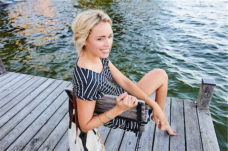 simsearch:649-05819818,k - Woman sitting on pier by water Stock Photo - Premium Royalty-Free, Code: 649-08988405