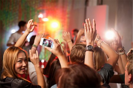 Teenagers photographing band on camera phones at concert Stock Photo - Premium Royalty-Free, Code: 649-09004369