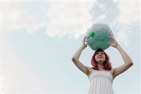 simsearch:6113-06499152,k - Young woman with globe Stock Photo - Premium Royalty-Free, Code: 649-09002545