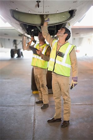 simsearch:649-07238739,k - Aircraft workers checking airplane Stock Photo - Premium Royalty-Free, Code: 649-09002574