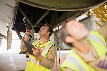 simsearch:649-07238739,k - Aircraft workers checking airplane Stock Photo - Premium Royalty-Free, Code: 649-09002575