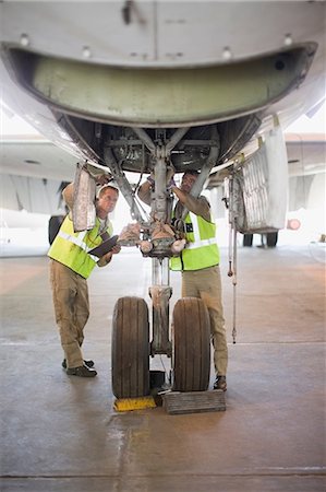 simsearch:649-07238739,k - Aircraft workers checking airplane Stock Photo - Premium Royalty-Free, Code: 649-09002576