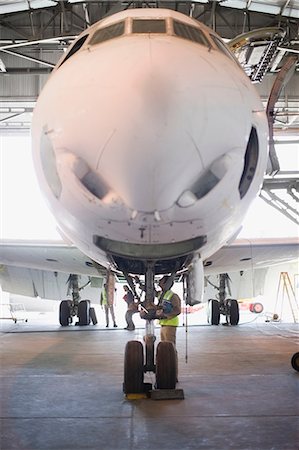simsearch:649-07238739,k - Aircraft worker checking airplane Stock Photo - Premium Royalty-Free, Code: 649-09002573