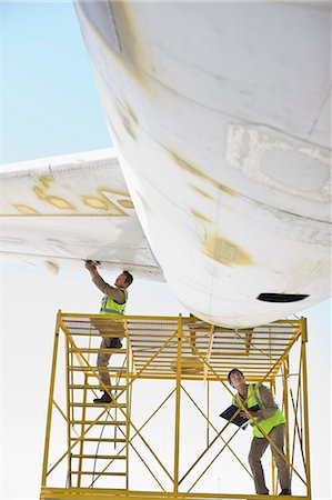 simsearch:649-07238739,k - Aircraft workers repairing airplane Stock Photo - Premium Royalty-Free, Code: 649-09002596
