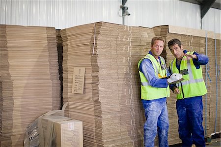 simsearch:649-07238739,k - Workers talking in factory Stock Photo - Premium Royalty-Free, Code: 649-09002615