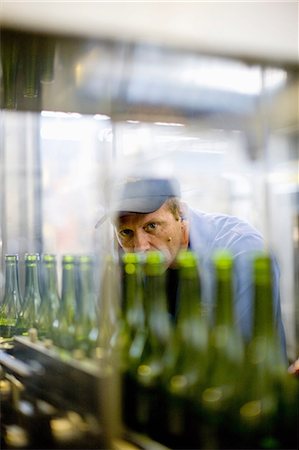 simsearch:649-07238739,k - Workers examining bottles in factory Stock Photo - Premium Royalty-Free, Code: 649-09002645