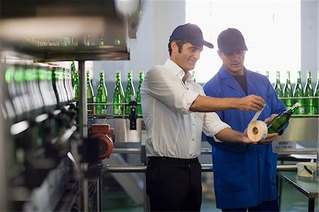 simsearch:649-07238739,k - Workers examining bottles in factory Stock Photo - Premium Royalty-Free, Code: 649-09002642