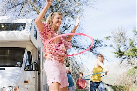Family using hula hoops with RV Stock Photo - Premium Royalty-Free, Code: 649-09002672