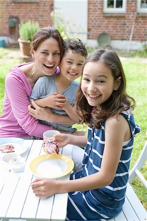 pre teen girl eating - Mother and children eating outdoors Stock Photo - Premium Royalty-Free, Code: 649-09002852