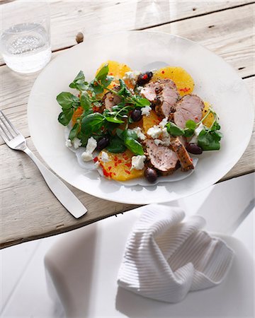simsearch:649-06352937,k - Plate of pork with pickled orange salad Stock Photo - Premium Royalty-Free, Code: 649-09003250