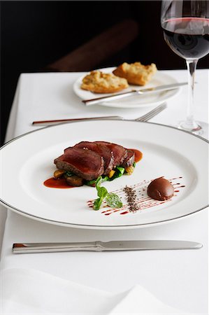 simsearch:649-06352937,k - Plate of beef with glass of wine Stock Photo - Premium Royalty-Free, Code: 649-09003353