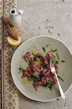 simsearch:649-06352937,k - Plate of meat with salad and lemon Stock Photo - Premium Royalty-Free, Code: 649-09003421