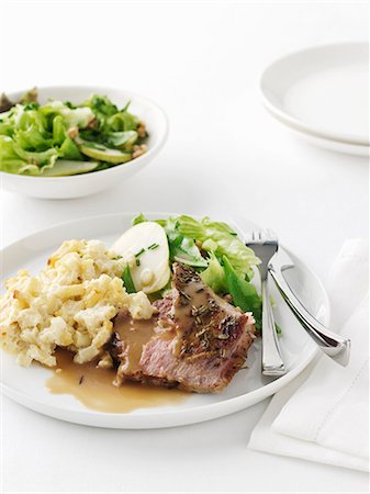 simsearch:649-06352937,k - Plate of roast lamb with potatoes Stock Photo - Premium Royalty-Free, Code: 649-09003532