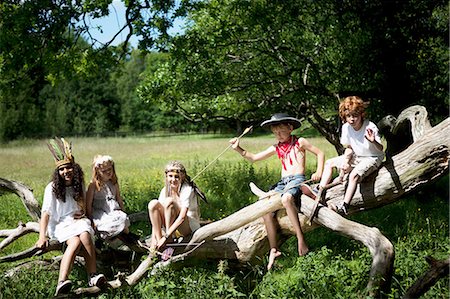 simsearch:614-03469543,k - Children in costumes playing on tree Stock Photo - Premium Royalty-Free, Code: 649-09003887