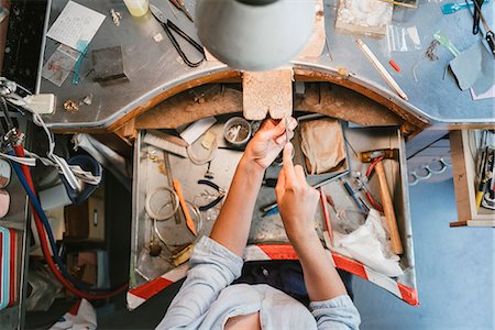 simsearch:6115-07109879,k - Overhead view of female jeweller's hands working at workbench Stock Photo - Premium Royalty-Free, Code: 649-09016531