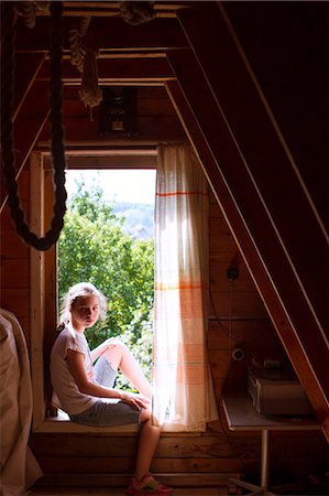 simsearch:649-07239584,k - Portrait of teenage girl sitting on sunlit bedroom windowsill Stock Photo - Premium Royalty-Free, Code: 649-09016600