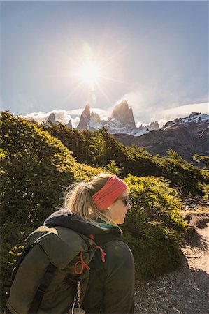 Female hiker hiking near sunlit  Fitz Roy mountain range in Los Glaciares National Park, Patagonia, Argentina Stock Photo - Premium Royalty-Free, Code: 649-09016711