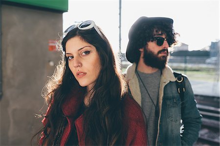 Portrait of young couple on train platform Stock Photo - Premium Royalty-Free, Code: 649-09025635