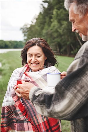 simsearch:649-07438003,k - Mature couple standing in rural setting, holding hot drink, woman wrapped in blanket Stock Photo - Premium Royalty-Free, Code: 649-09025690
