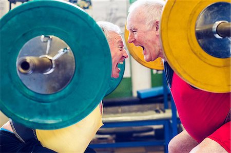 senior men at the gym - Two senior powerlifters face to face, shouting Stock Photo - Premium Royalty-Free, Code: 649-09035408