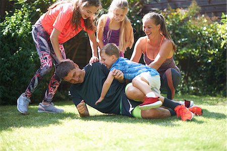 female teens kids smiling - Family playing in garden Stock Photo - Premium Royalty-Free, Code: 649-09035804