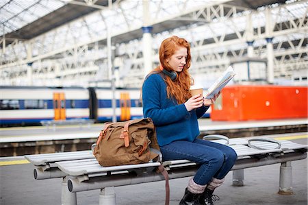 Woman on bench on train station platform, London Stock Photo - Premium Royalty-Free, Code: 649-09078039