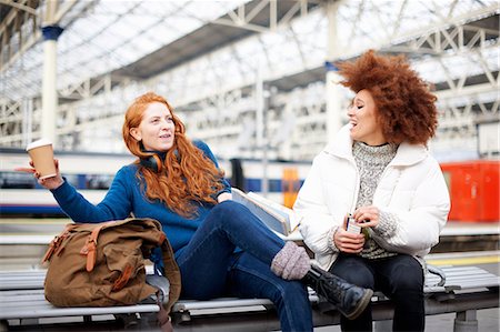 Friends on bench on train station platform, London Stock Photo - Premium Royalty-Free, Code: 649-09078040