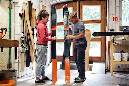 simsearch:649-07710266,k - Man and woman in workshop, inspecting ski equipment Stock Photo - Premium Royalty-Free, Code: 649-09111436