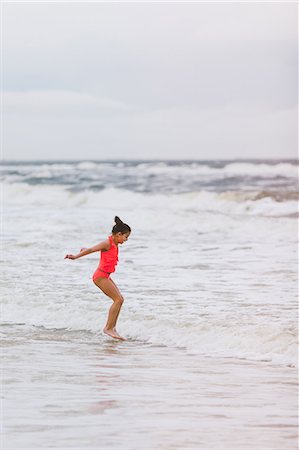 preteen bathing suit - Girl jumping ocean waves, Dauphin Island, Alabama, USA Stock Photo - Premium Royalty-Free, Code: 649-09124035