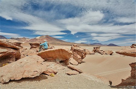 simsearch:614-08065889,k - Woman sitting on rock, looking at view, Villa Alota, Potosi, Bolivia, South America Stock Photo - Premium Royalty-Free, Code: 649-09123300