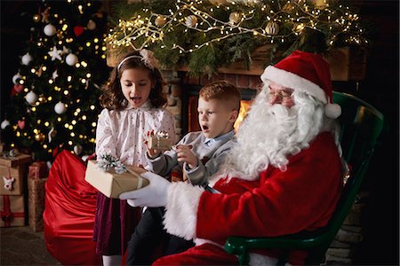 simsearch:640-03260410,k - Young girl and boy visiting Santa, receiving gifts Stock Photo - Premium Royalty-Free, Code: 649-09123659
