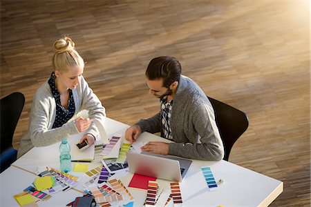 simsearch:649-06845199,k - Male and female designer discussing colour swatches on design studio table Stock Photo - Premium Royalty-Free, Code: 649-09123906