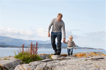 simsearch:649-07437107,k - Man and son strolling by fjord, Aure, More og Romsdal, Norway Stock Photo - Premium Royalty-Free, Code: 649-09138974