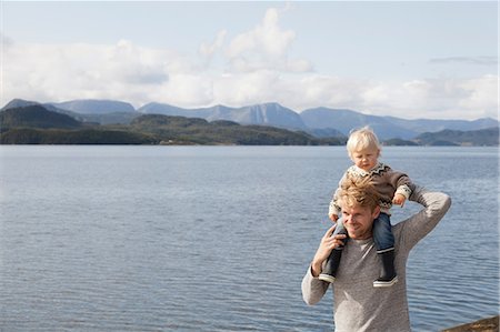 simsearch:649-07437107,k - Man giving son shoulder ride by fjord, Aure, More og Romsdal, Norway Stock Photo - Premium Royalty-Free, Code: 649-09138973