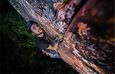 Rock climber climbing sandstone rock, elevated view, Liming, Yunnan Province, China Stock Photo - Premium Royalty-Free, Code: 649-09148466