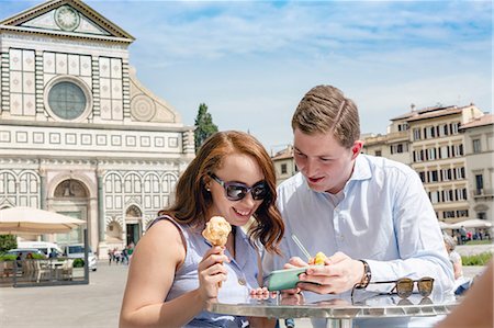 simsearch:649-07560084,k - Young couple using mobile phone, Santa Maria Novella Church and Square, Florence, Toscana, Italy Stock Photo - Premium Royalty-Free, Code: 649-09159130