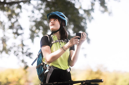 Biker stopping in park Stock Photo - Premium Royalty-Free, Code: 649-09182243